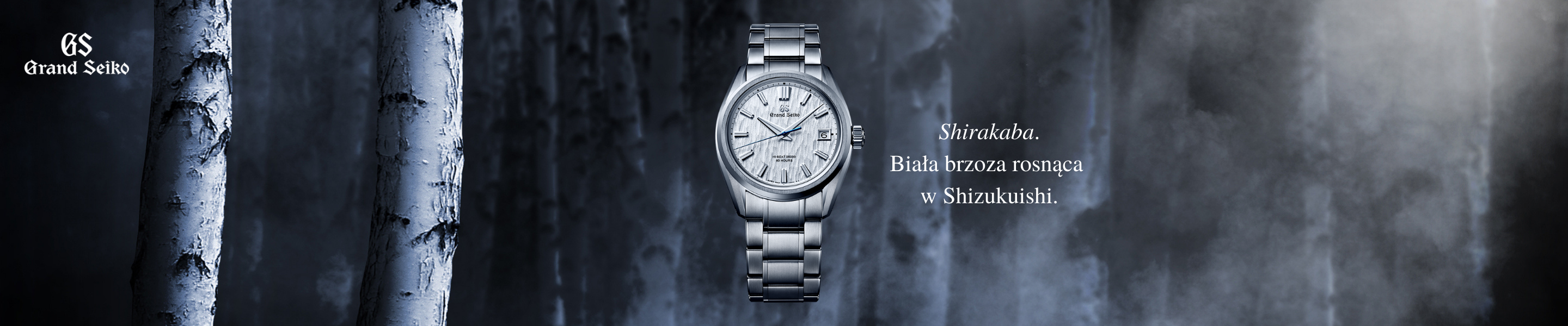 Grand-seiko logo with a watch in front of a foggy forest